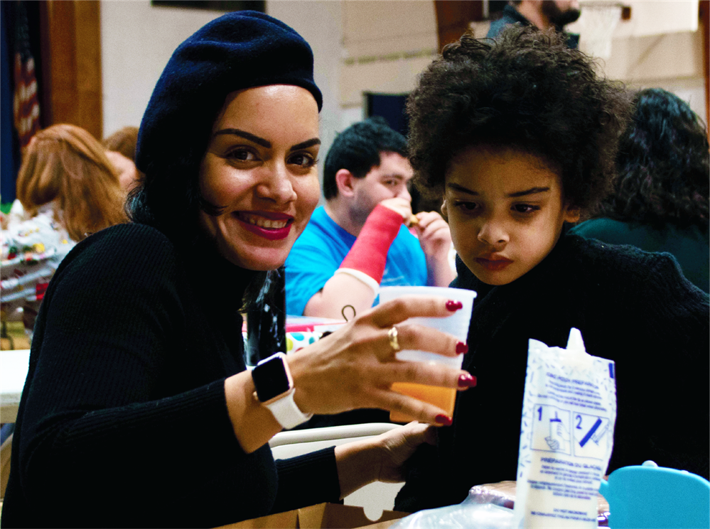   Parent and student at our December 2022 Family Night enjoying a gingerbread activity together.